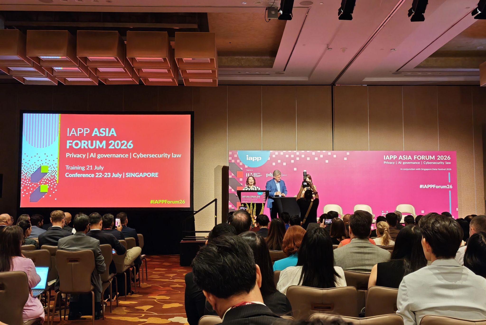IAPP Asia Forum 2026 conference in Singapore with attendees gathered for sessions on privacy, AI governance, and cybersecurity law.